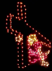 Festive angel decoration in colorful lights